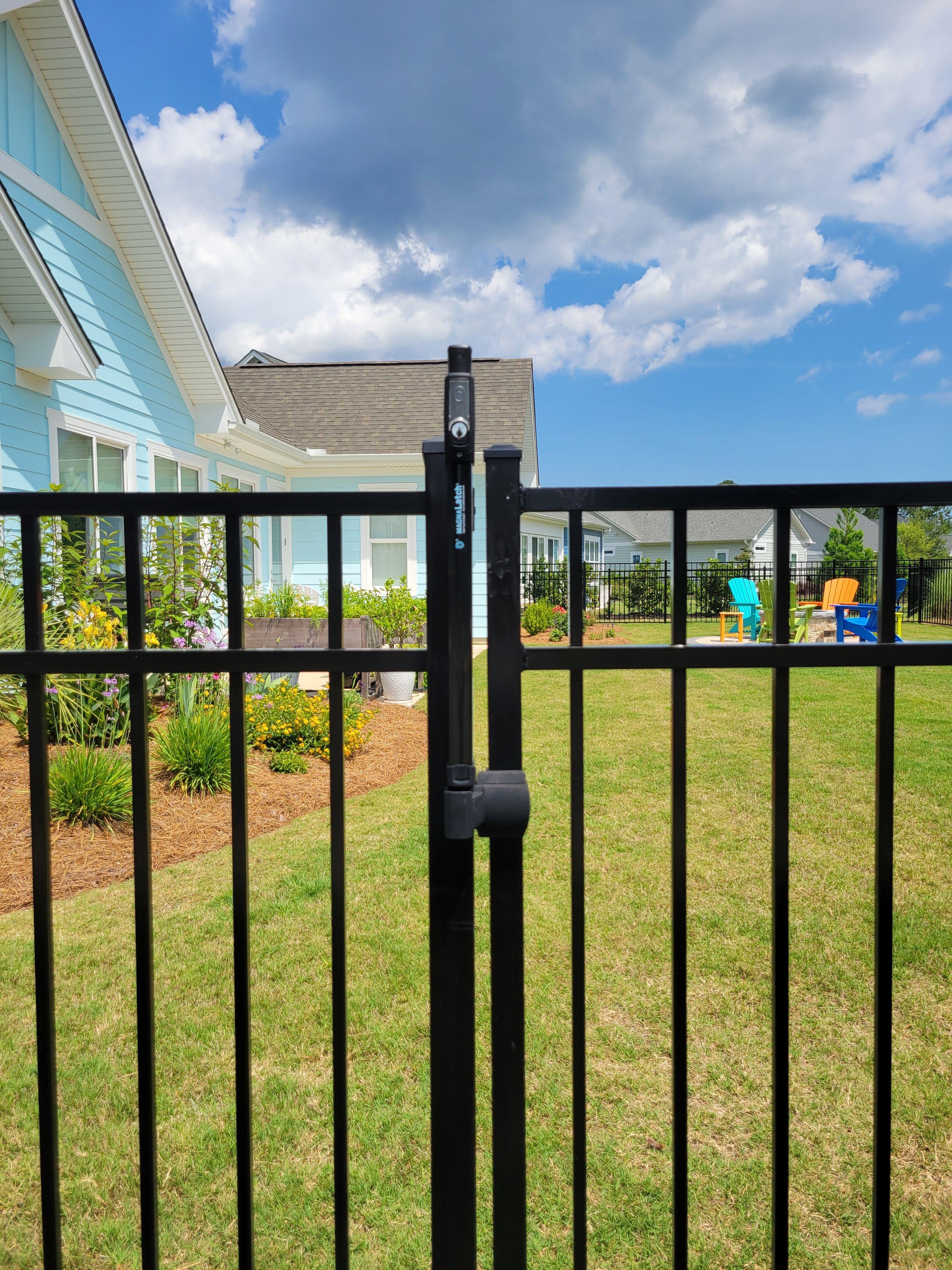 Pool-code compliant aluminum fence ensuring safety around swimming pools