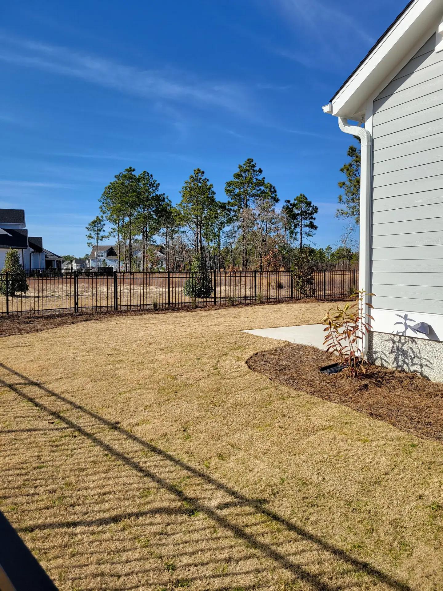 Black aluminum residential fence with decorative pickets for family homes