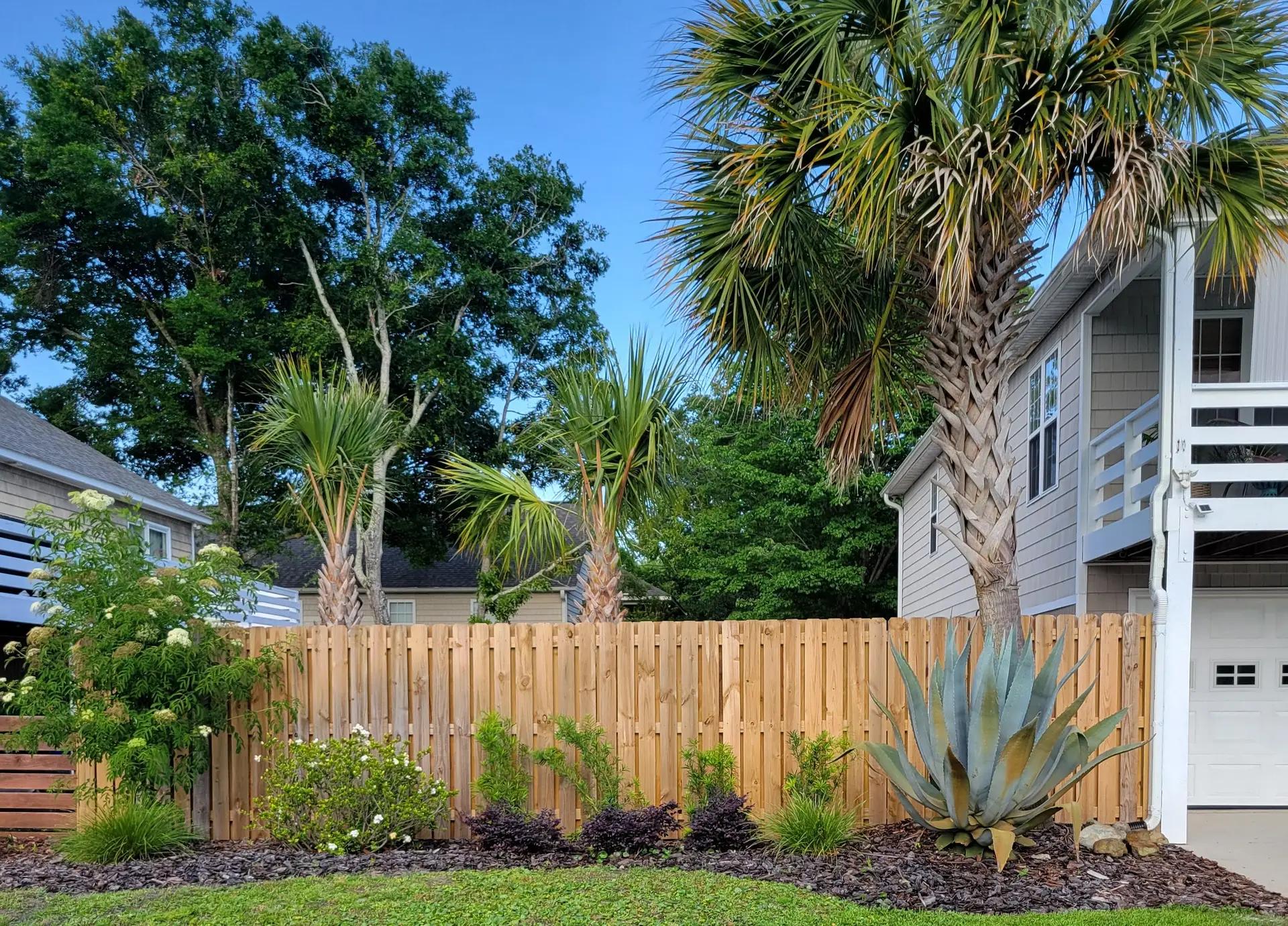 Secure wooden privacy fence in coastal setting